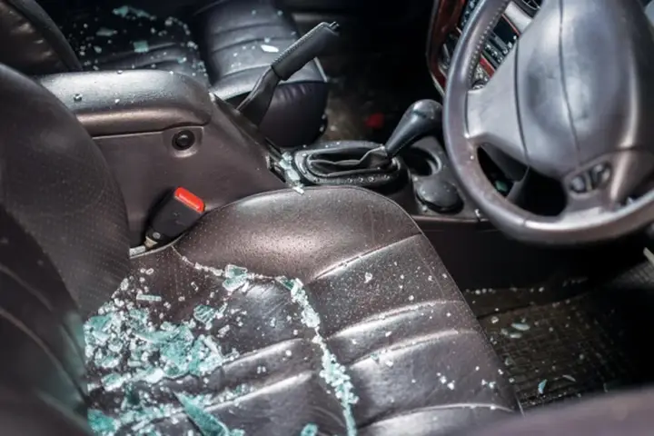 Broken glass on a car seat before clean-up