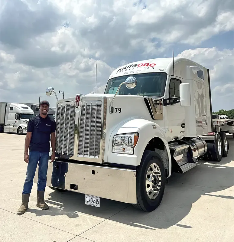 truck driver near a white truck