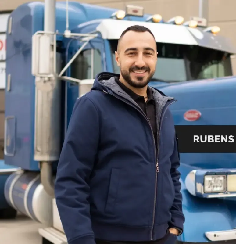 Rubens near a blue truck