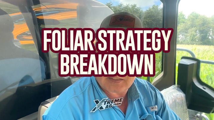 Man in a vehicle with "FOLIAR STRATEGY BREAKDOWN" text overlay, wearing a cap and blue shirt, trees visible outside.
