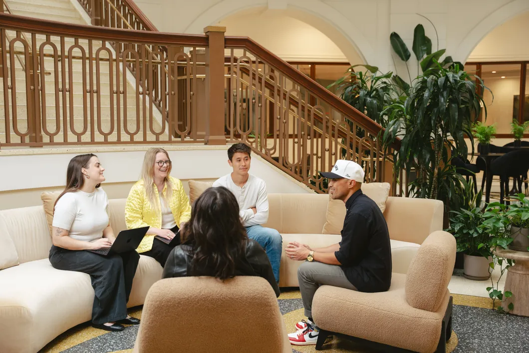 The Earnest team chatting together in the office
