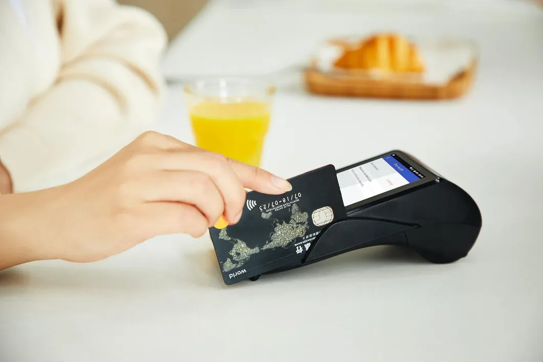 person-sliding-credit-card-in-card-reader