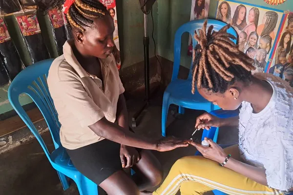 applying nail polish girl