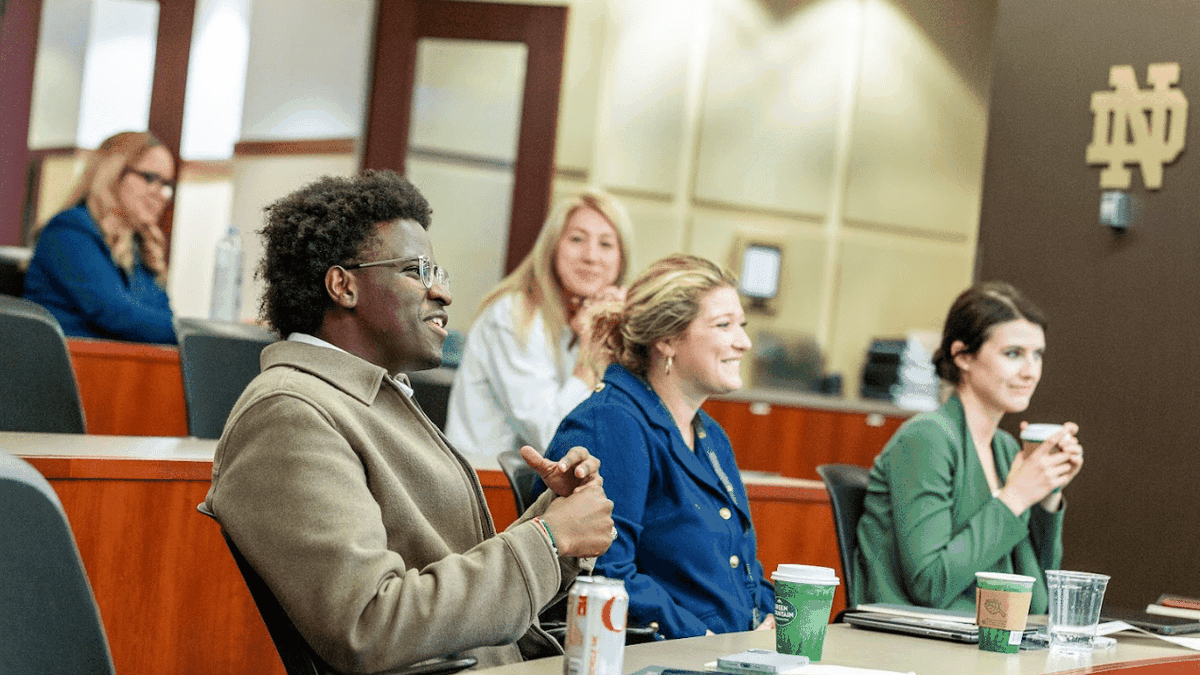 Attendees interacting at a forum event