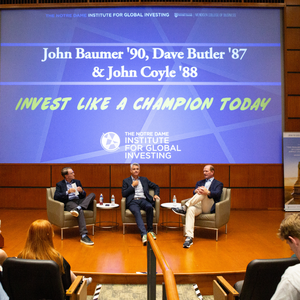 Invest Like A Champion Today Photo John Baumer, Dave Butler, and John Coyle sitting on stage giving a speaker series chat to students