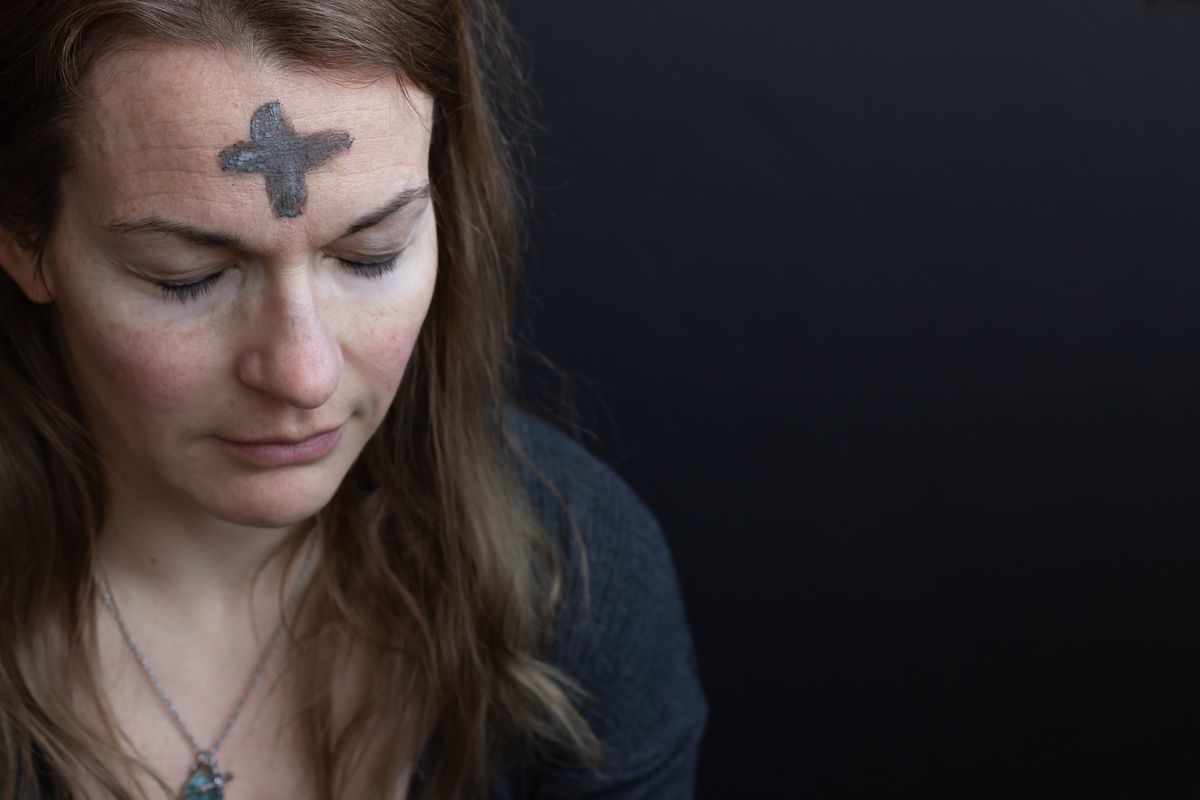 Image of woman with ash in shape of cross on head