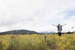 Image of a woman in field representing adoration