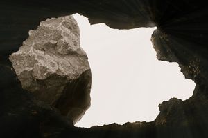 Image of an opening in a rock tomb representing Jesus' resurrection
