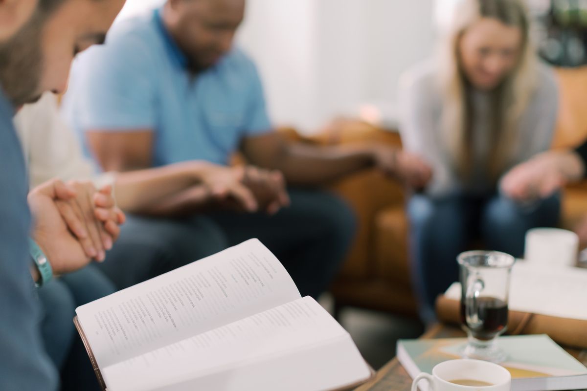 Image of people praying with collects