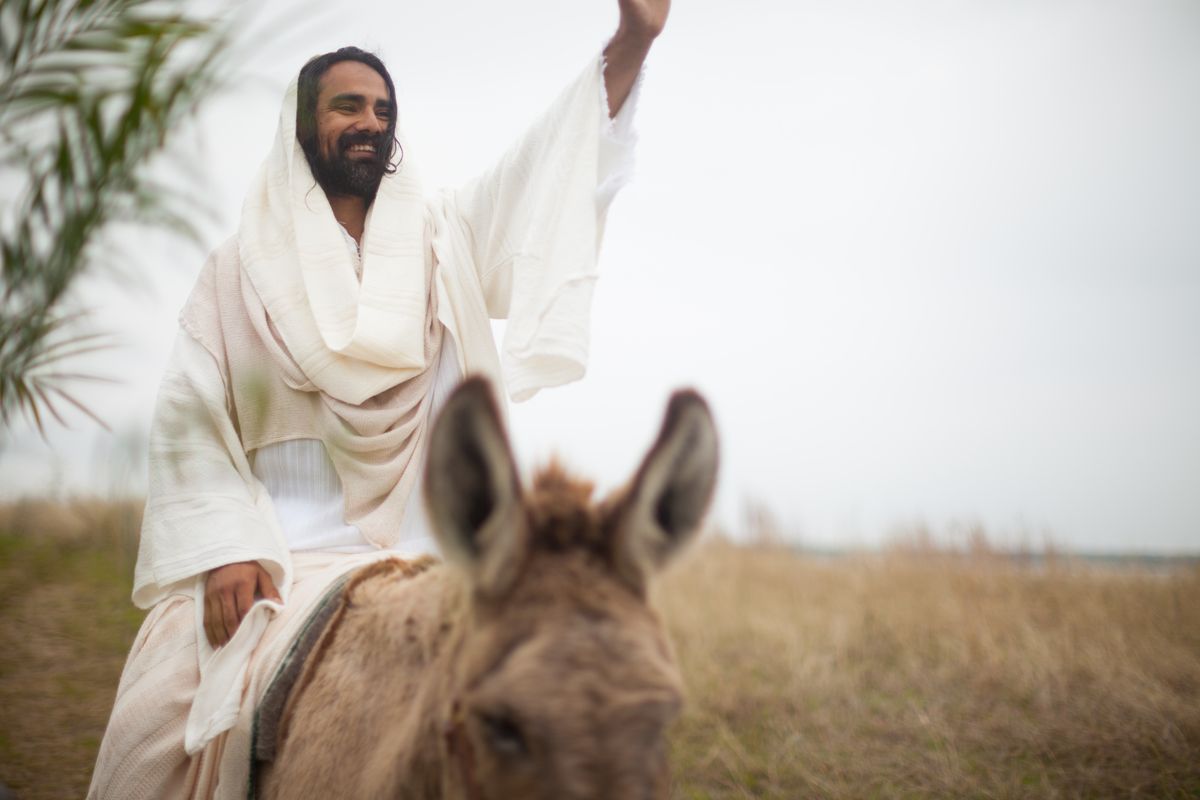 Image of Jesus riding on a donkey for Palm Sunday