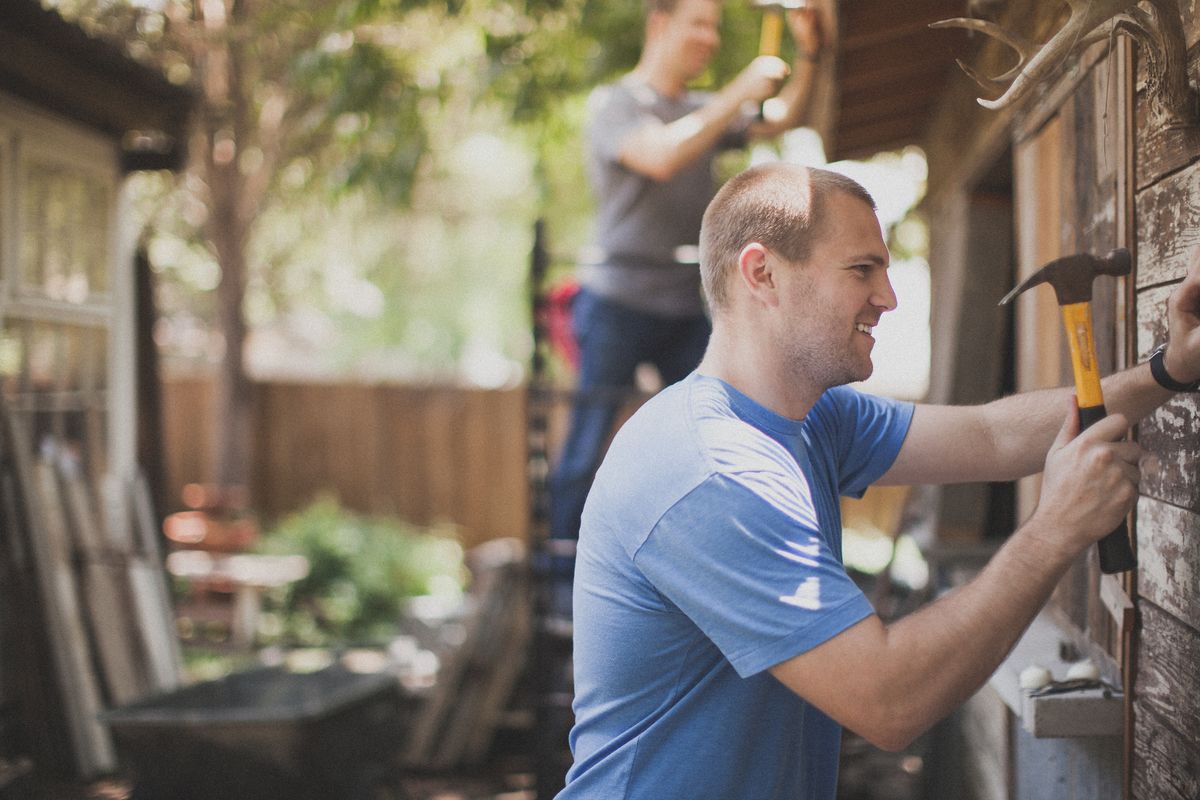 Man hammering representing service