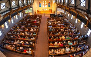 An overhead view of full pews in a church.