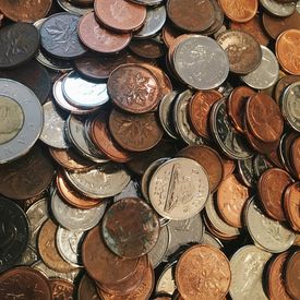 A collection of coins from Canada and the United States.
