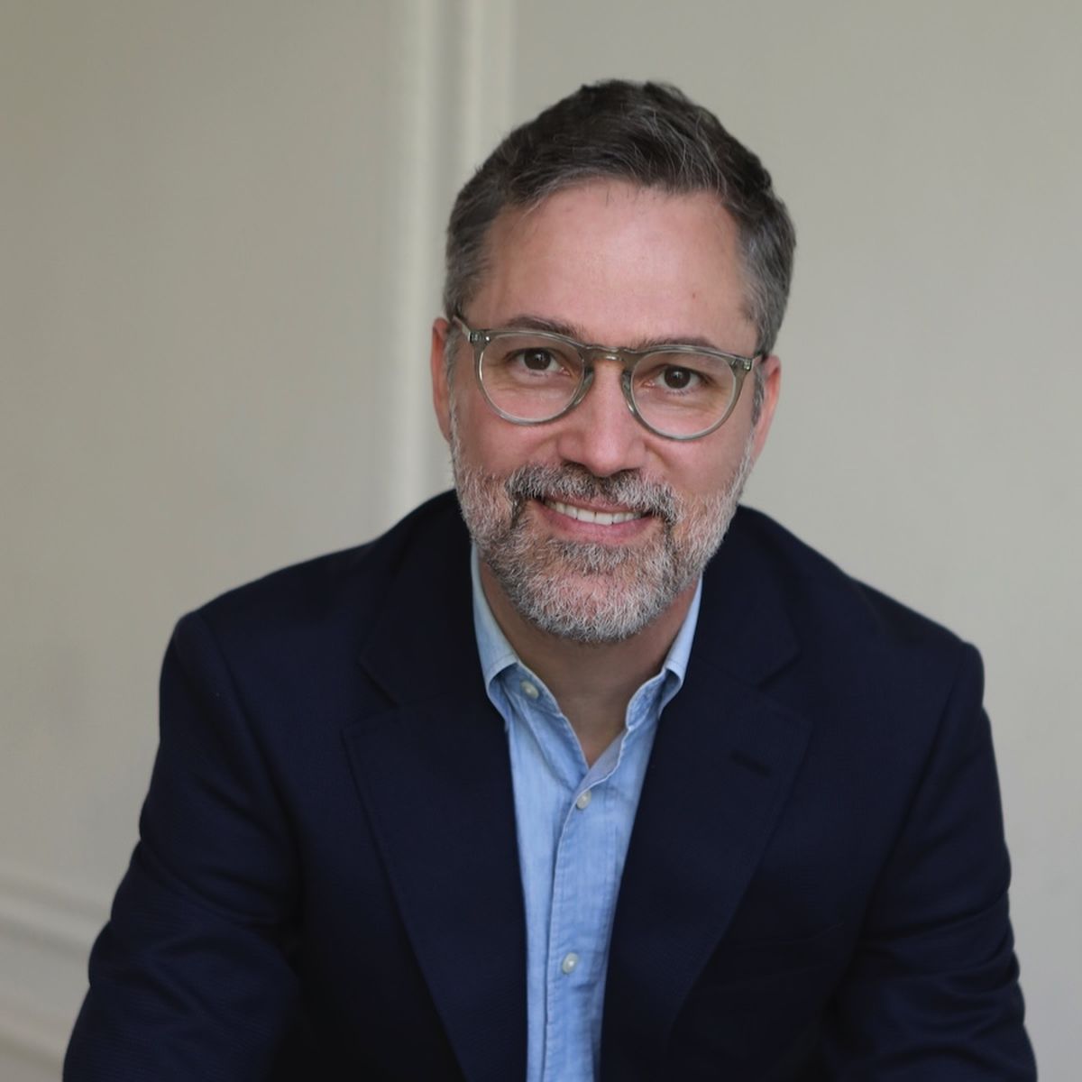 A headshot of Aaron Abramson, a middle aged man with glasses and a beard.