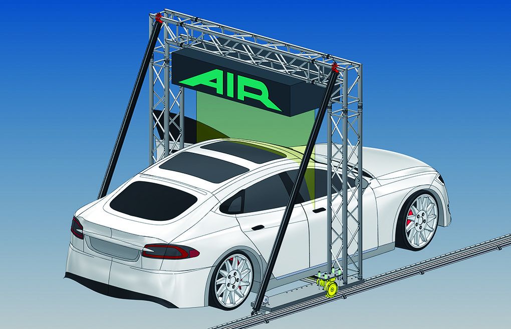 CAD rendering of the AIR system showing top-down X-ray scanning for full-vehicle battery inspection