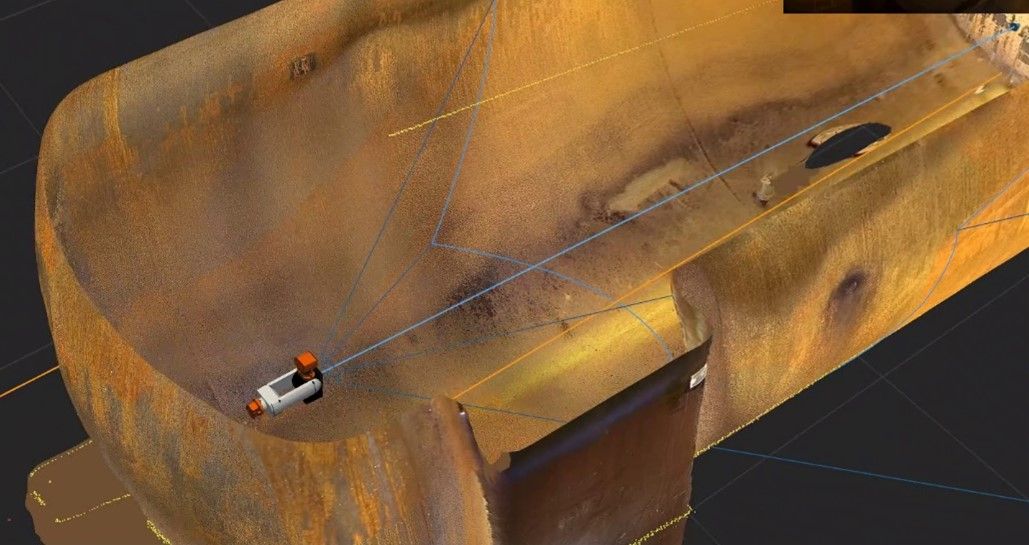 3D model of a rusty container with a small device inside, surrounded by blue lines coming from the device.