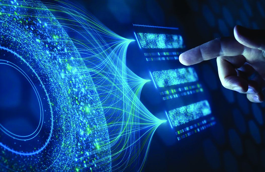 Hand touching glowing digital data panels linked by streams of blue and green light in an abstract network