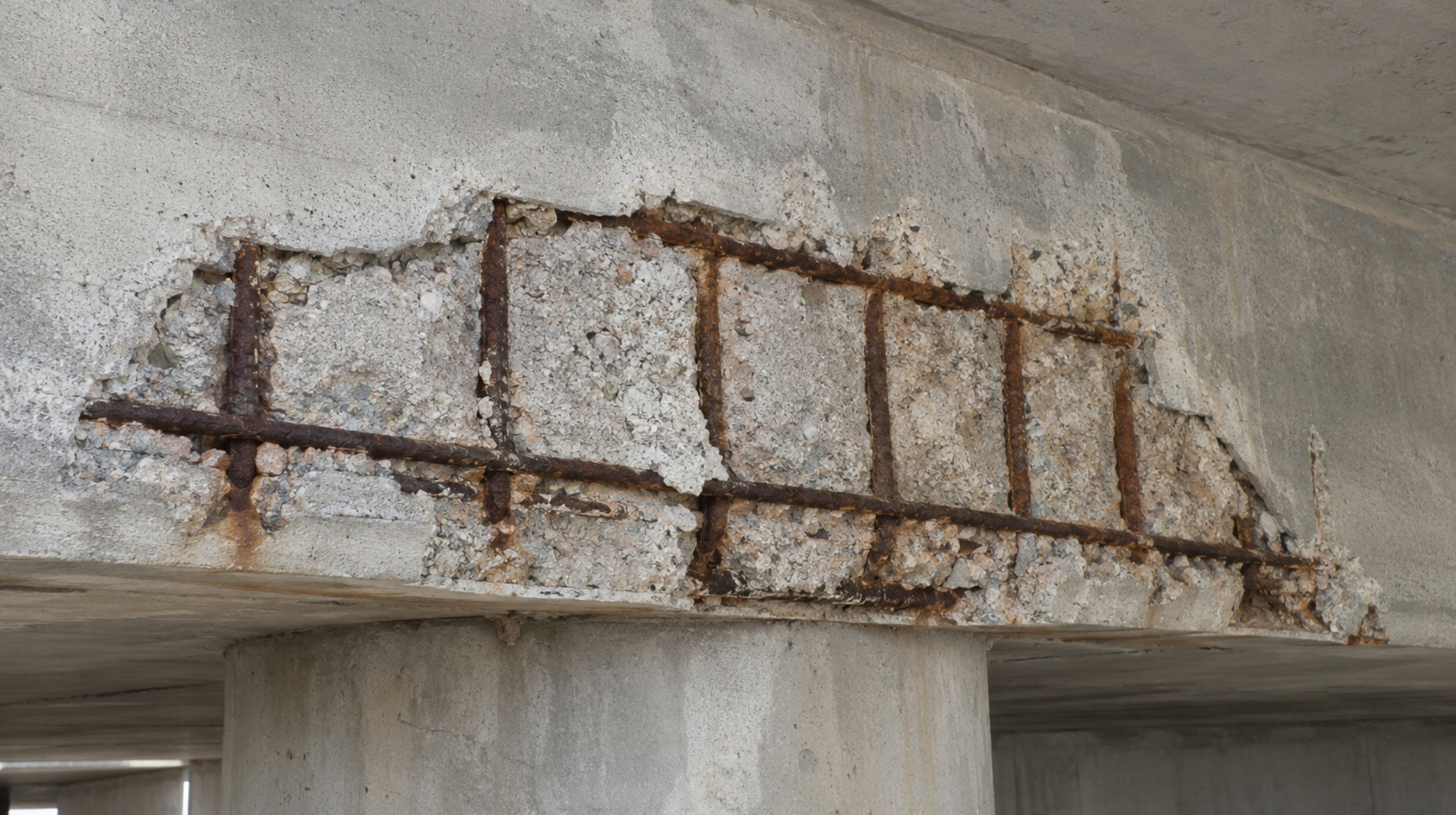 Exposed, corroded rebar in a deteriorated concrete structure