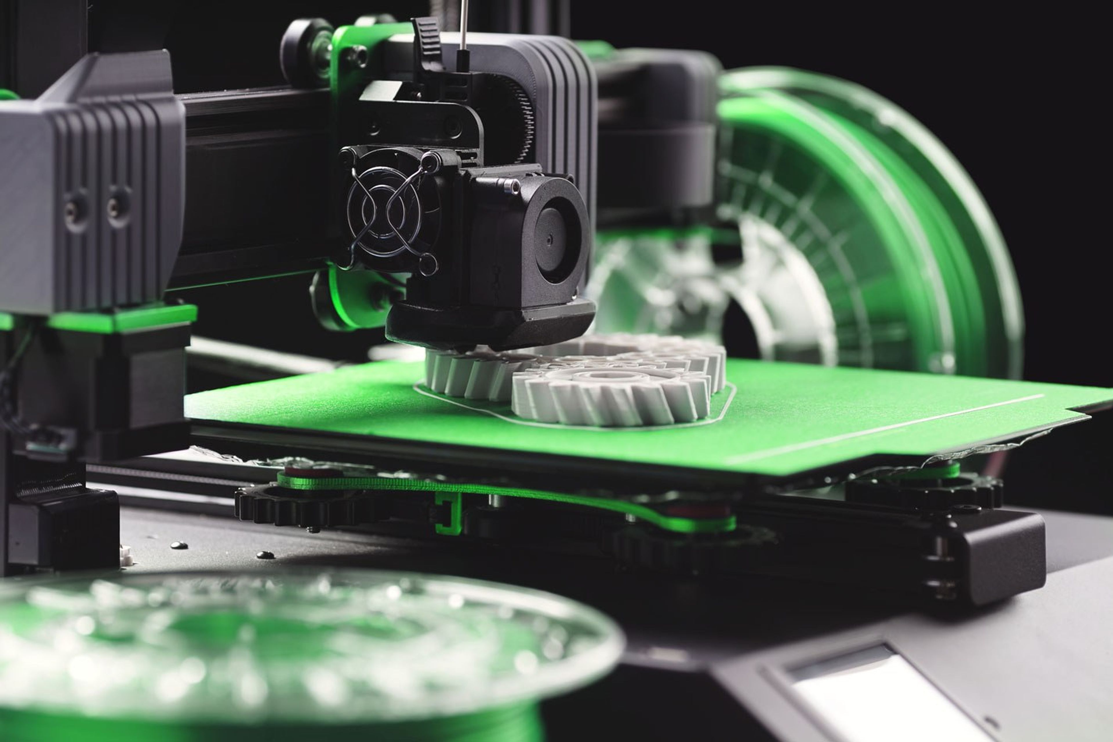 Additive manufacturing metal part being produced by an industrial 3D printer.