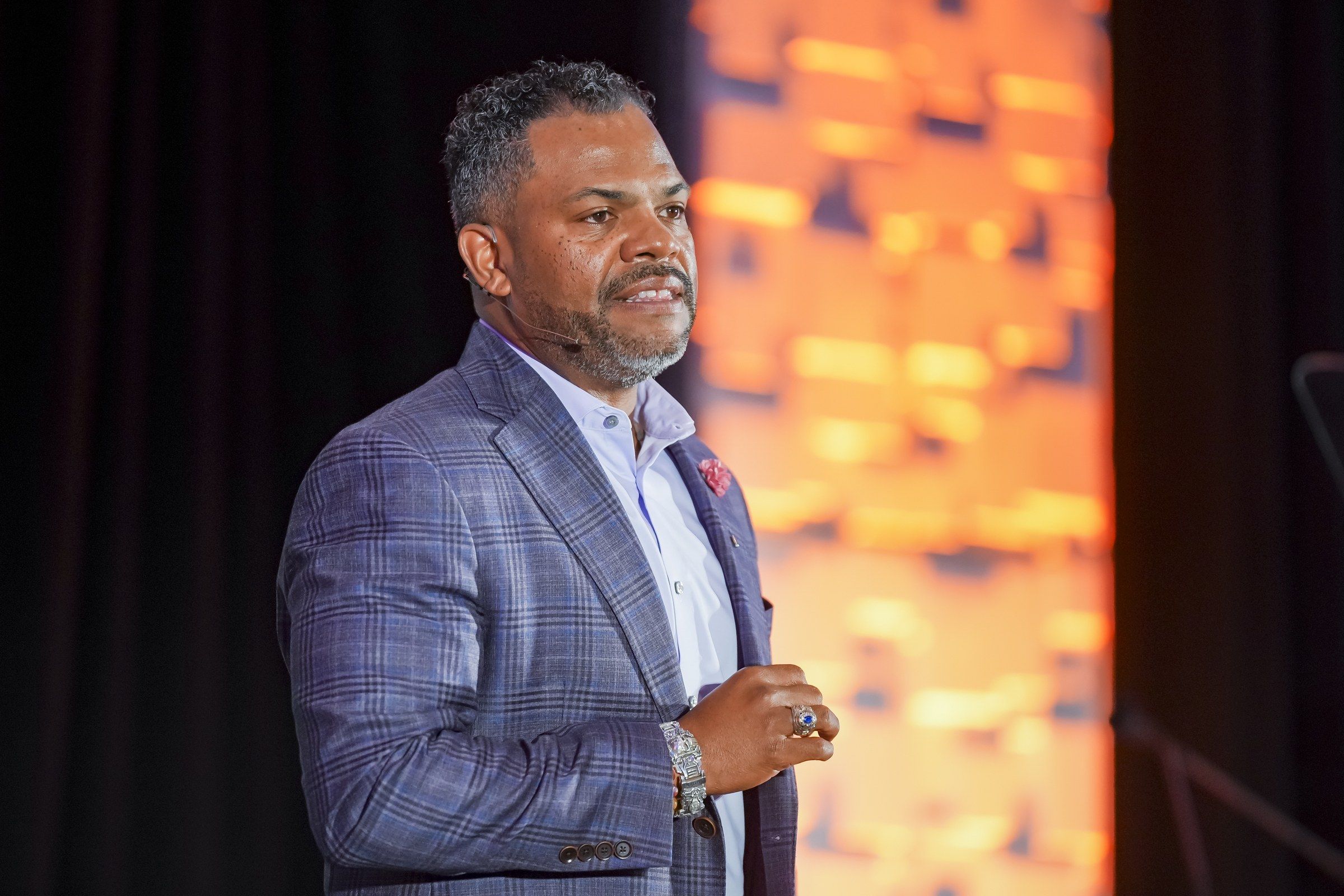 Jason O. Harris speaking onstage during the ASNT 2026 opening keynote