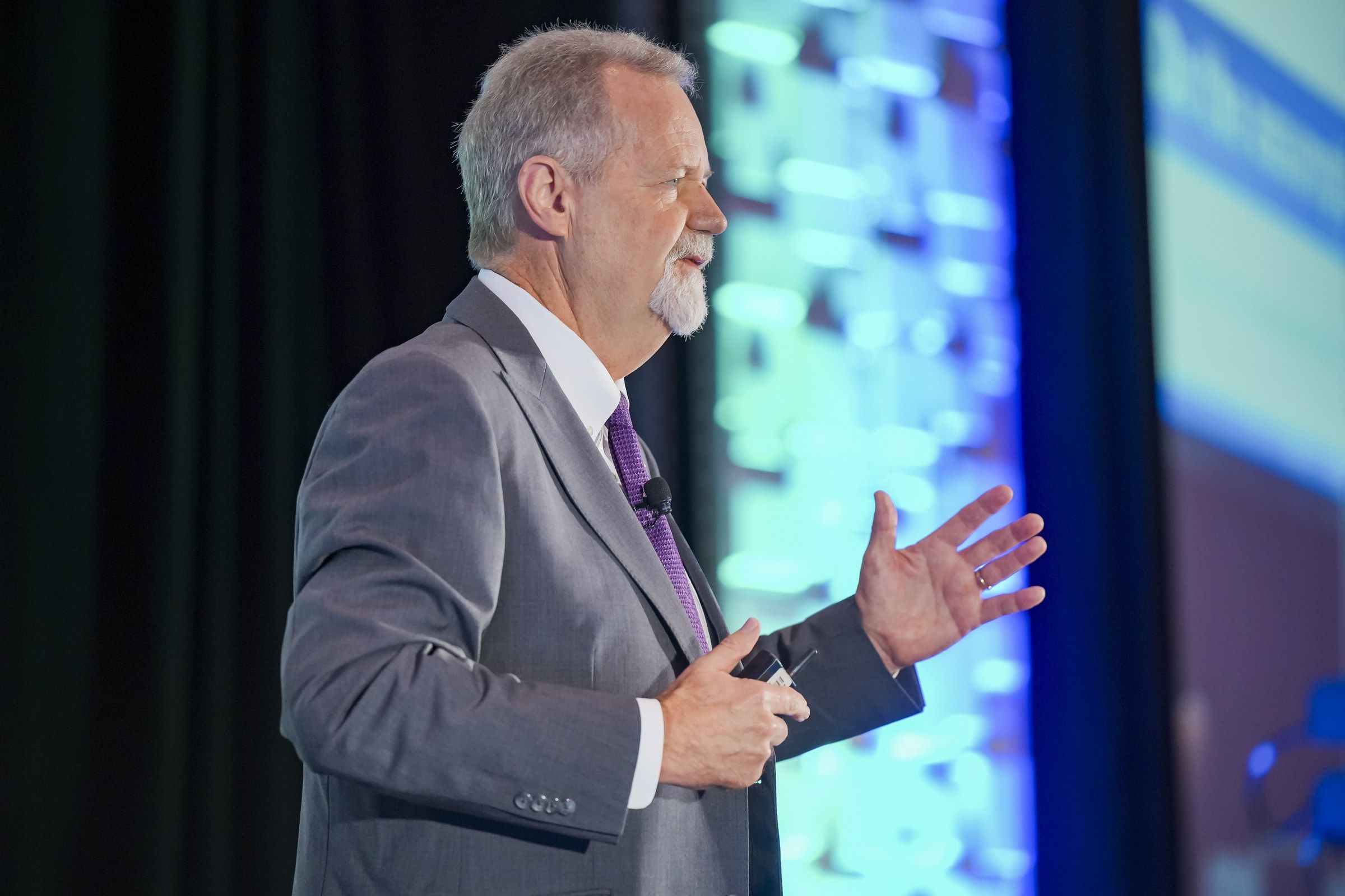 Clyde May gesturing as he speaks onstage at the ASNT 2026 general session on SNT-TC-1A