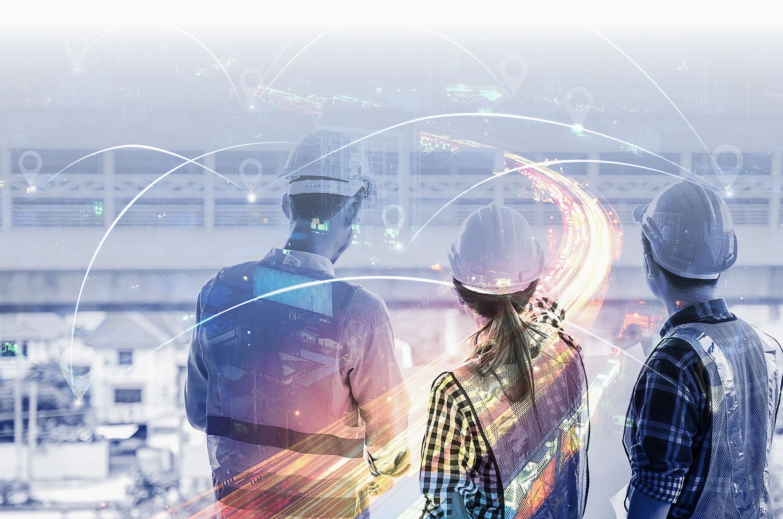 Three NDT workers in hard hats and vests look at a futuristic cityscape with glowing lines and city lights.