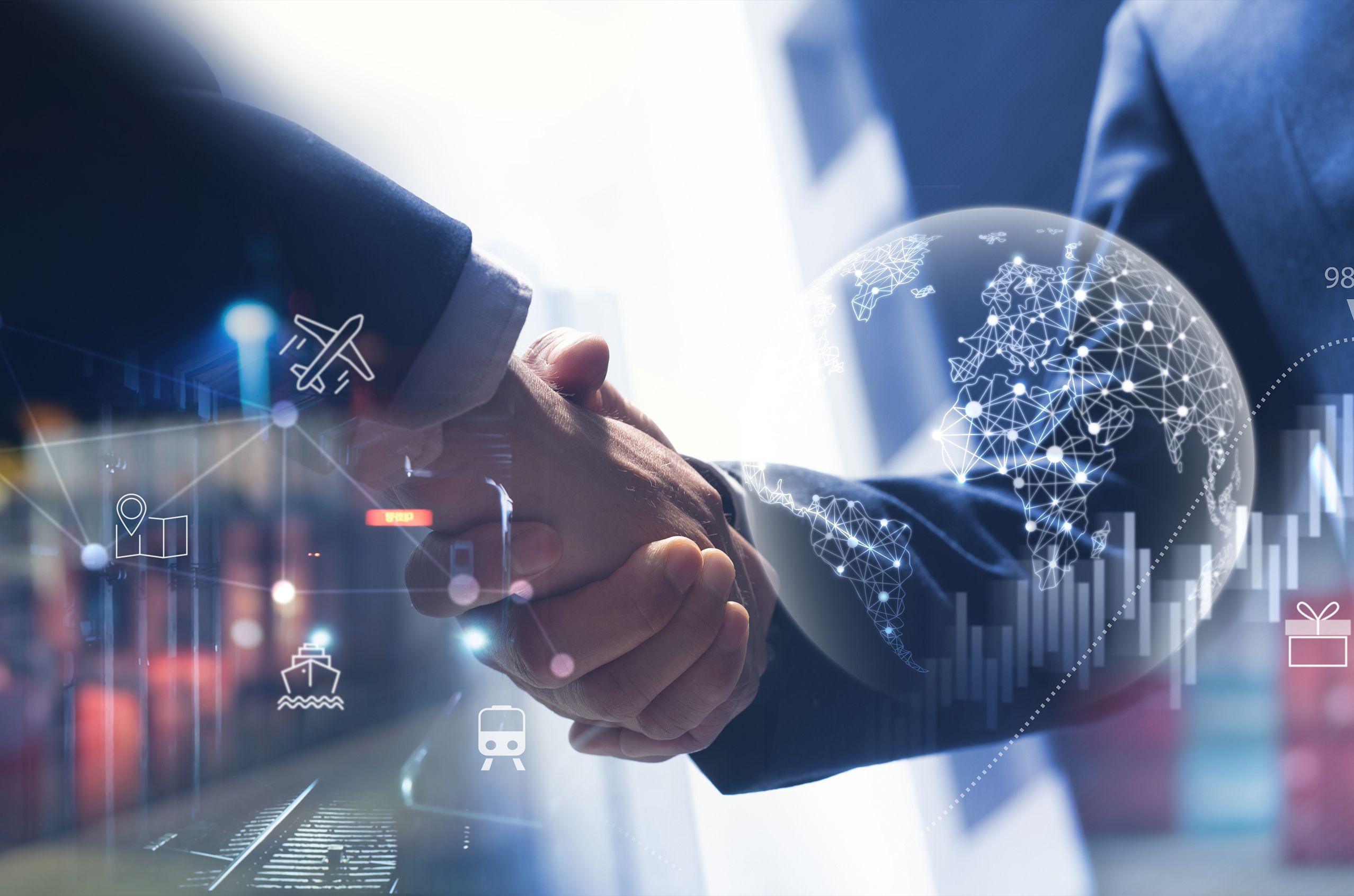 Shaking hands against a backdrop of a digital world, symbolizing global collaboration and innovation.