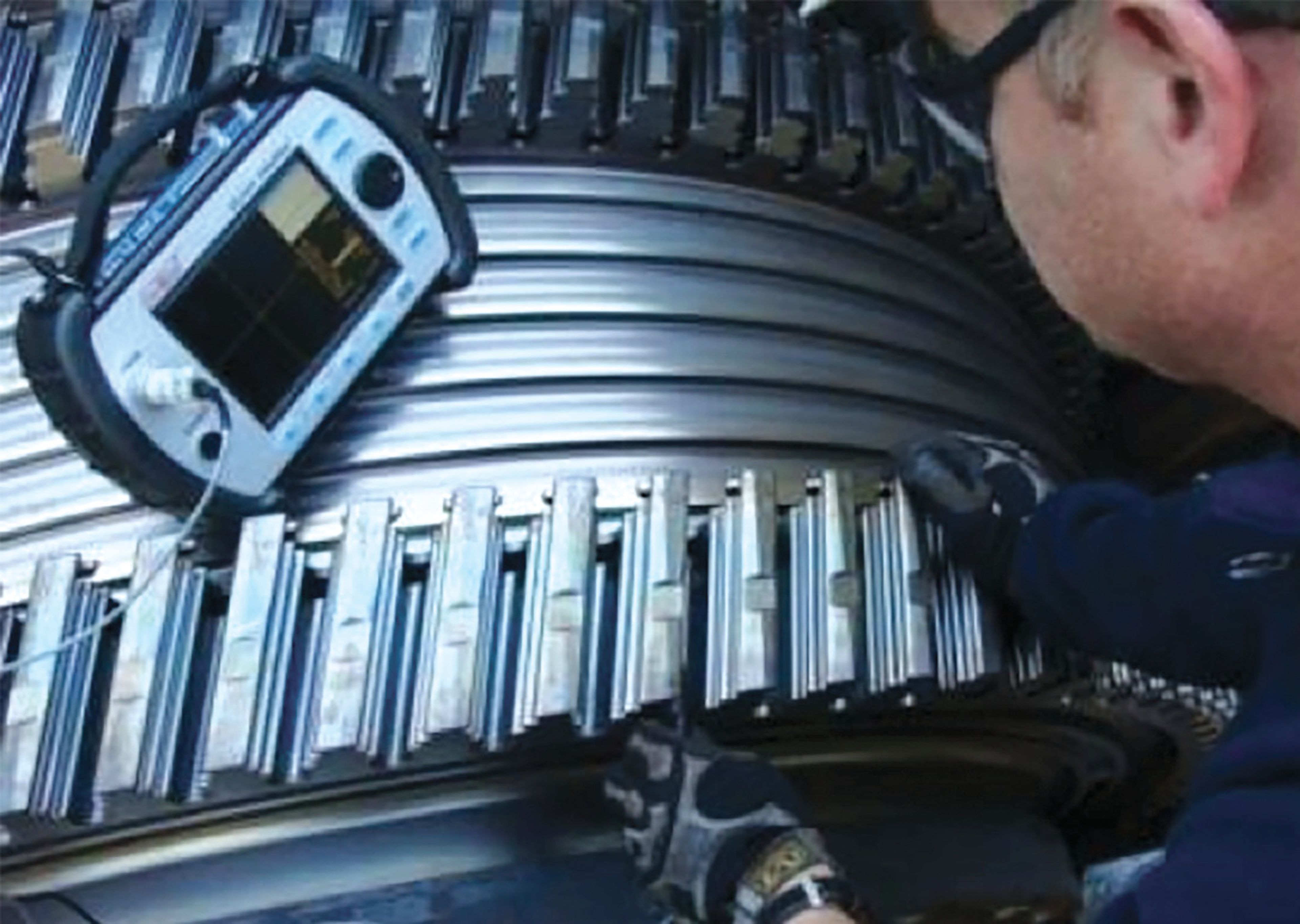 Eddy current inspection of a curved metallic surface