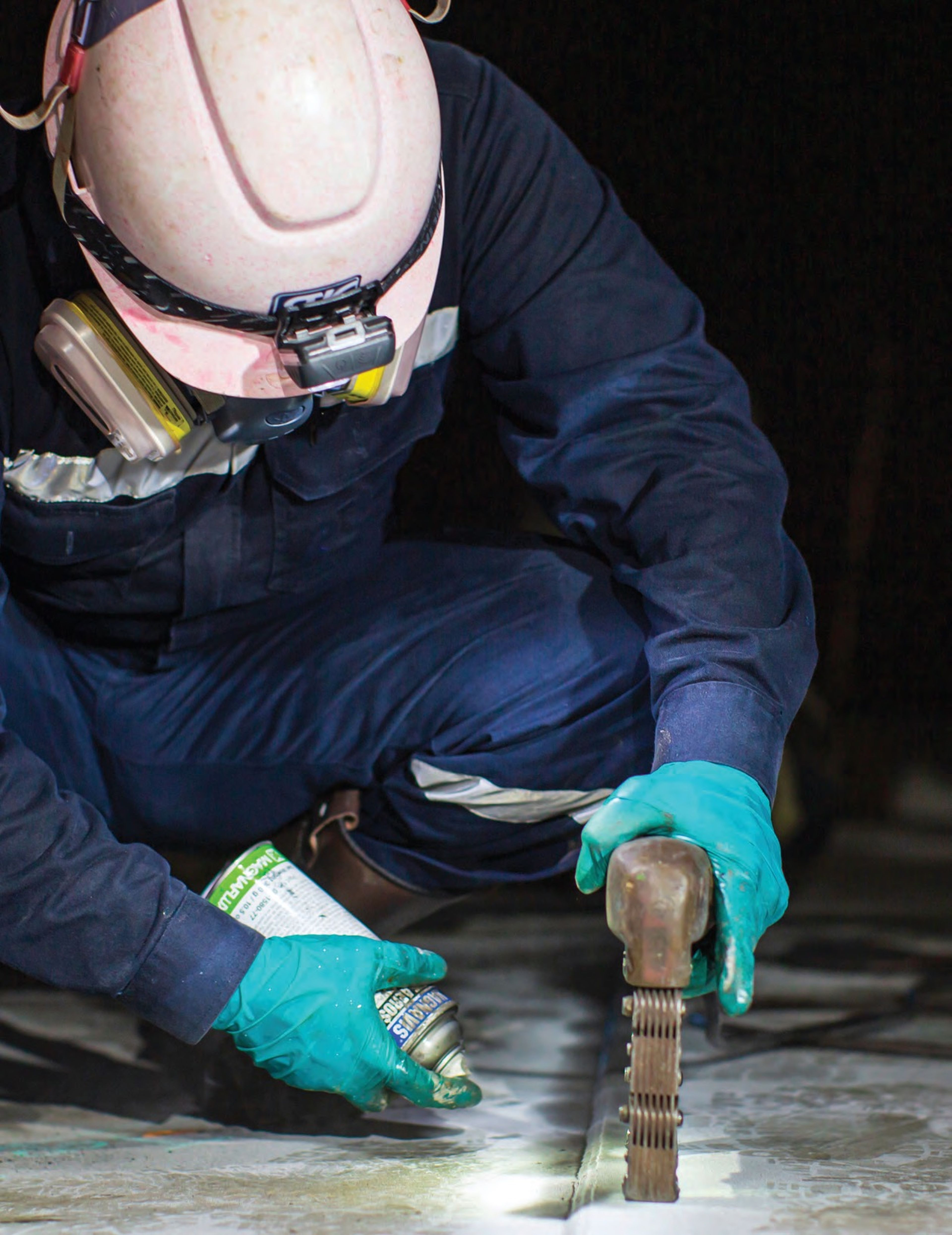 NDT professional performing liquid penetrant inspection