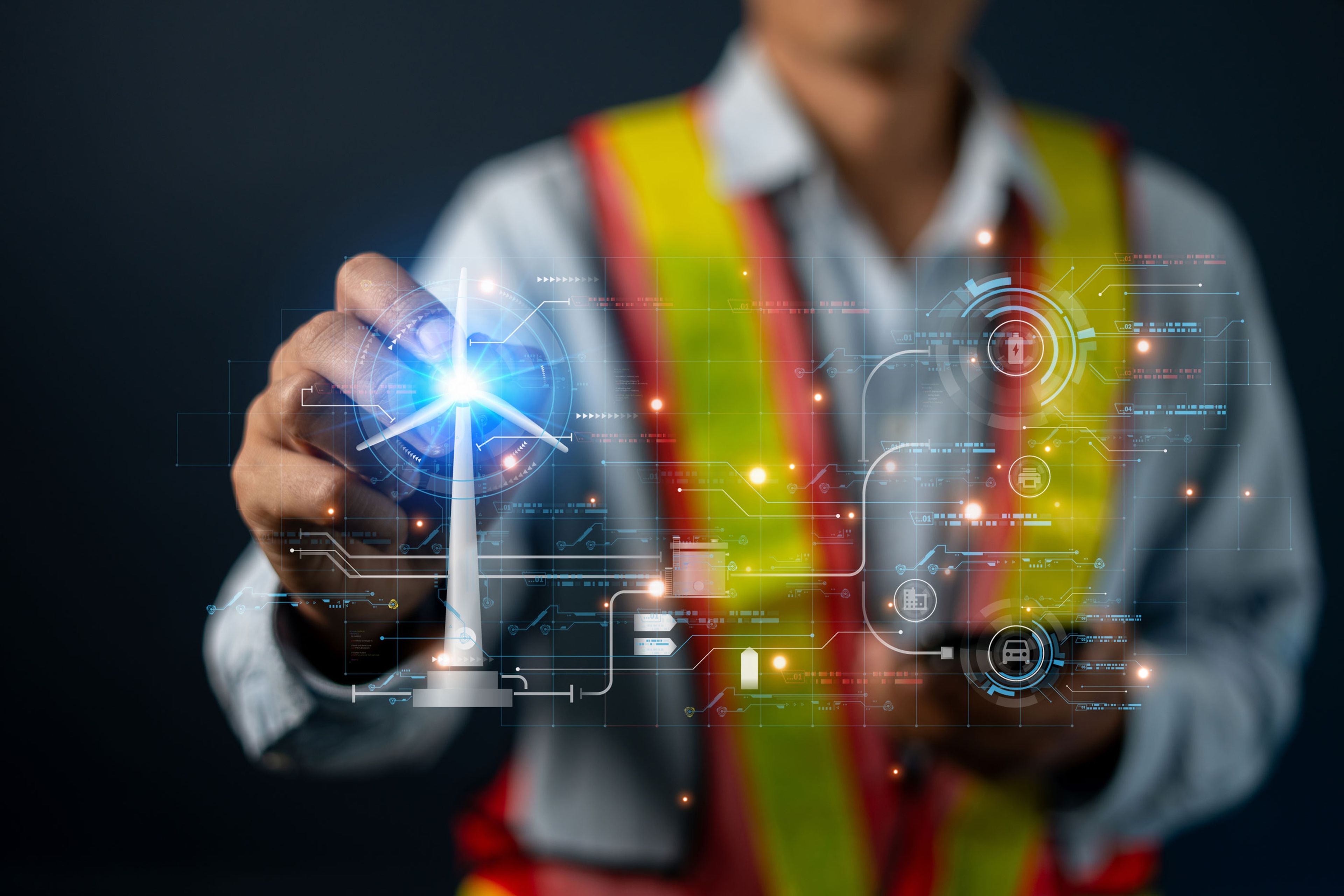A worker in a hi-vis vest touches a futuristic holographic interface showing a wind turbine and digital data icons.