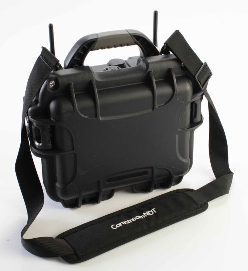 A black, rugged carrying case with a handle and shoulder strap, featuring two antennas and the text "Carestream NDT" on the strap.