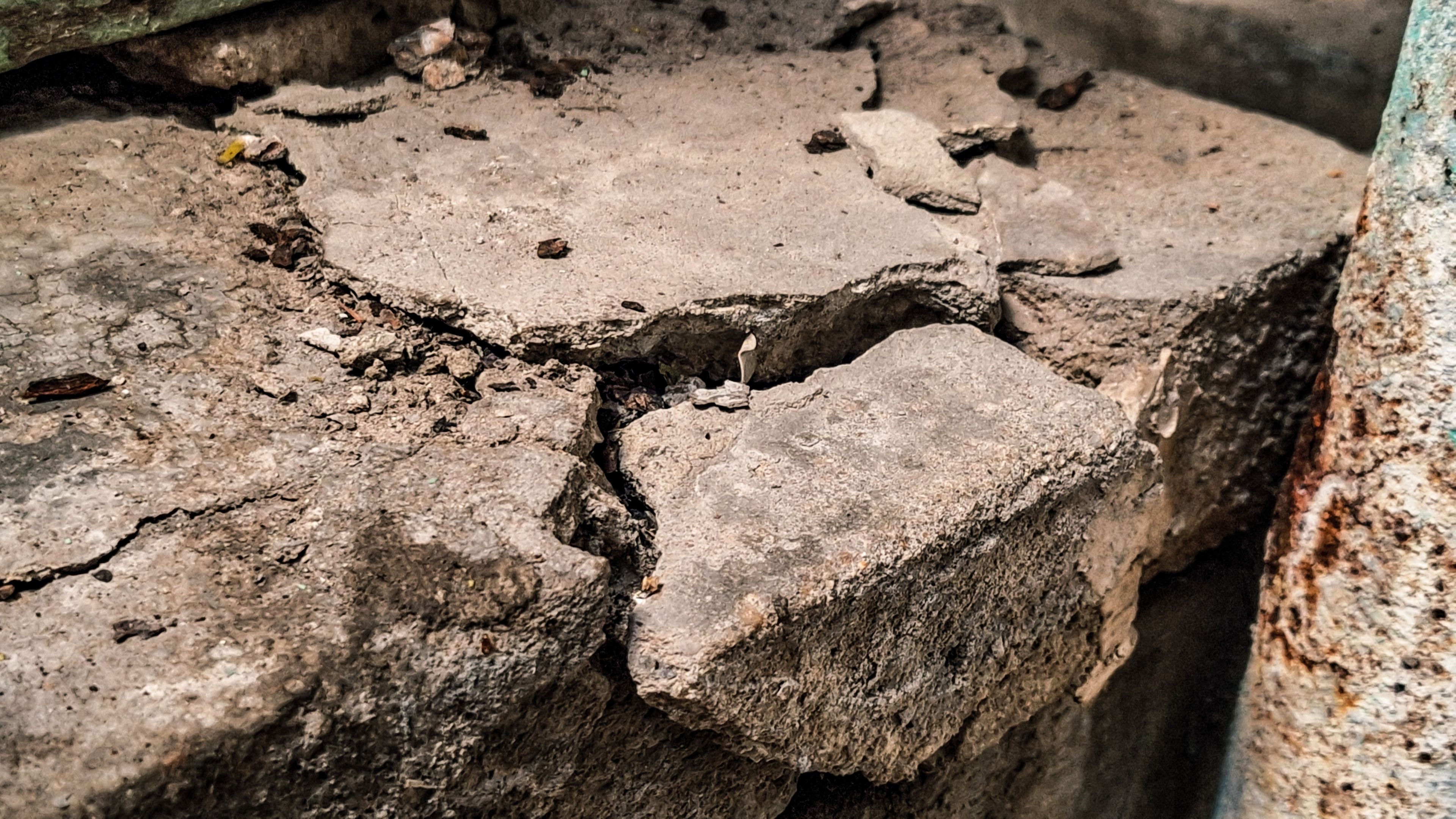 Concrete test specimens being prepared and cured on a construction site for compressive strength testing