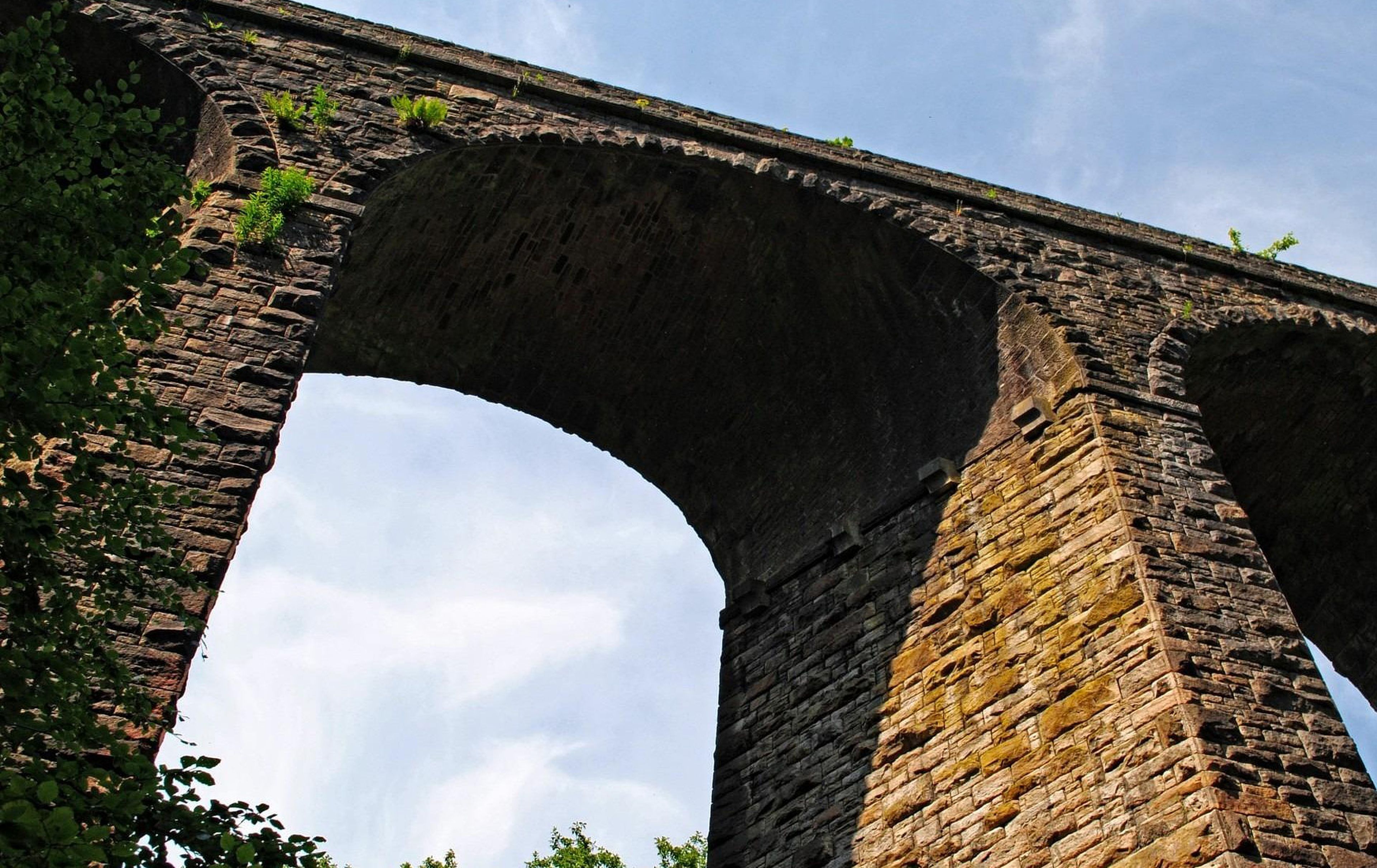 Arched masonry bridge spanning a waterway