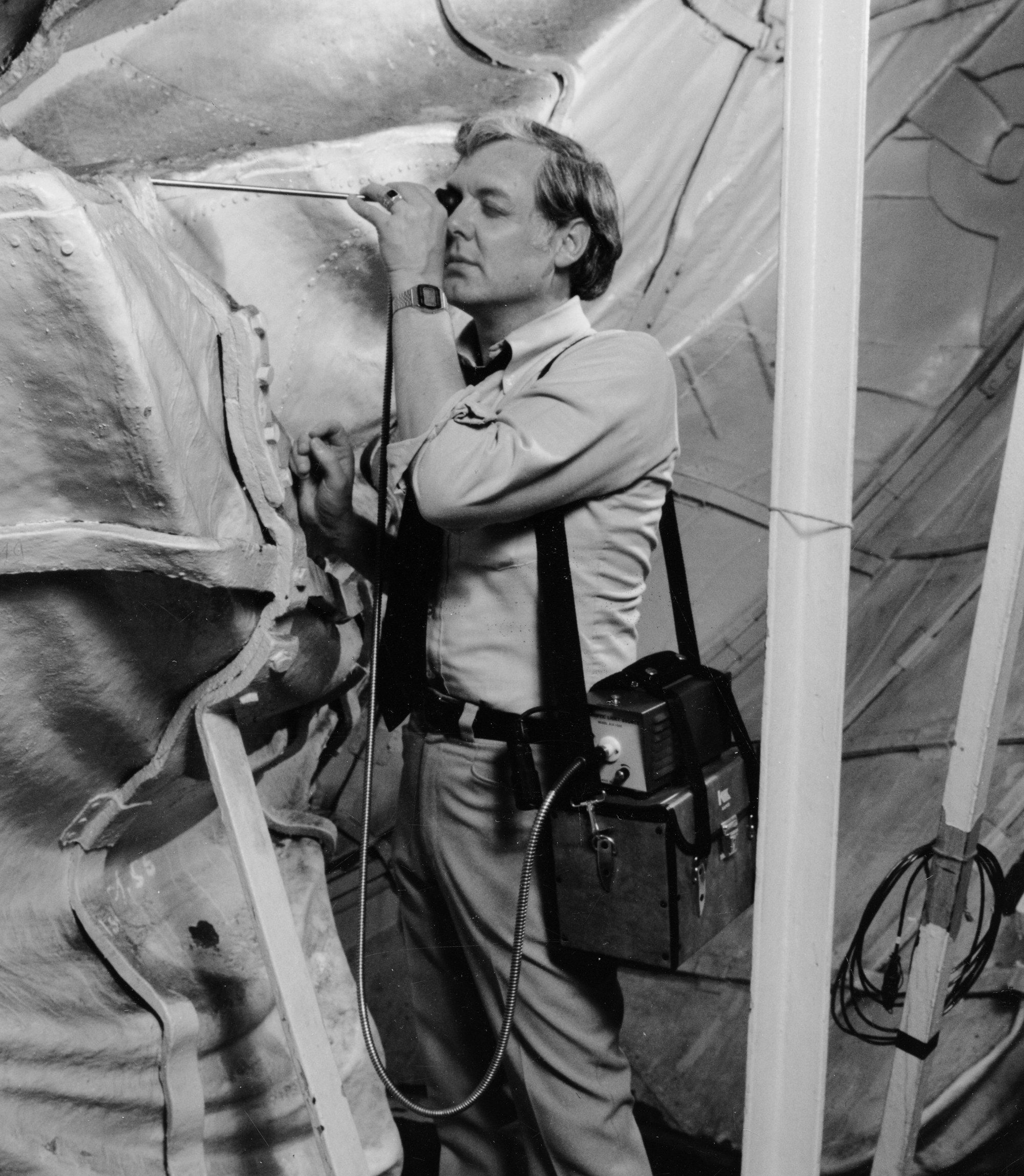 Blaine Cliver, then regional chief architect of the National Park Service, uses a flexible fiber optic borescope to examine a weld joint in the Statue of Liberty during the monument’s pre-centennial restoration in the mid-1980s. The inspection assessed structural condition in areas inaccessible to visual examination, including the statue’s fingers, which were critical supports for the torch. Photo from Materials Evaluation, July 1986; courtesy of the Olympus Corp.