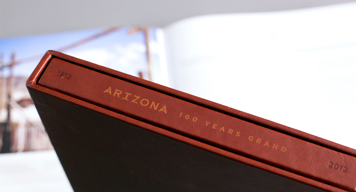 Close up of the spine inside the hardbound casing of the 'Arizona: 100 Years Grand' book