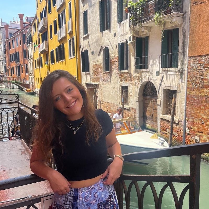Lainey smiling in front of the Venice canals