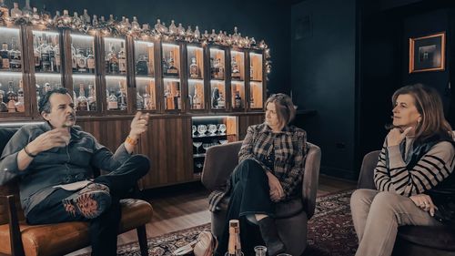 Brian conversing with two At The Table guests