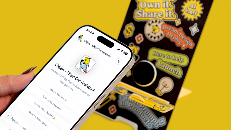 Hand holding a smartphone with Chippy AI app in front of the NFC-enabled phone stand