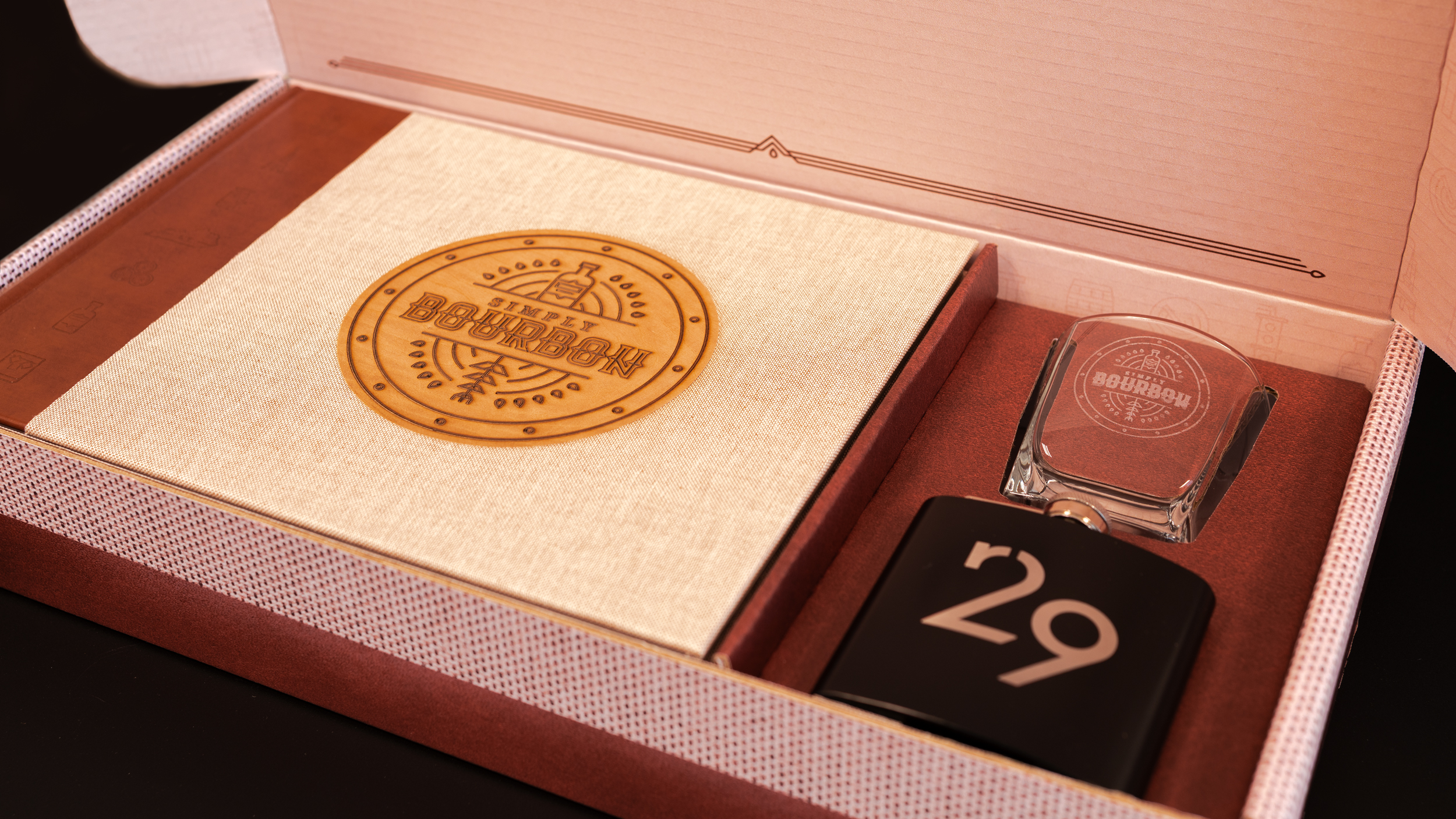 Bourbon Book brand box opened to show book, flask, and glass