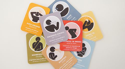 A collection of colorful health cards with Swahili text and icons depicting various symptoms, such as coughing and nausea.