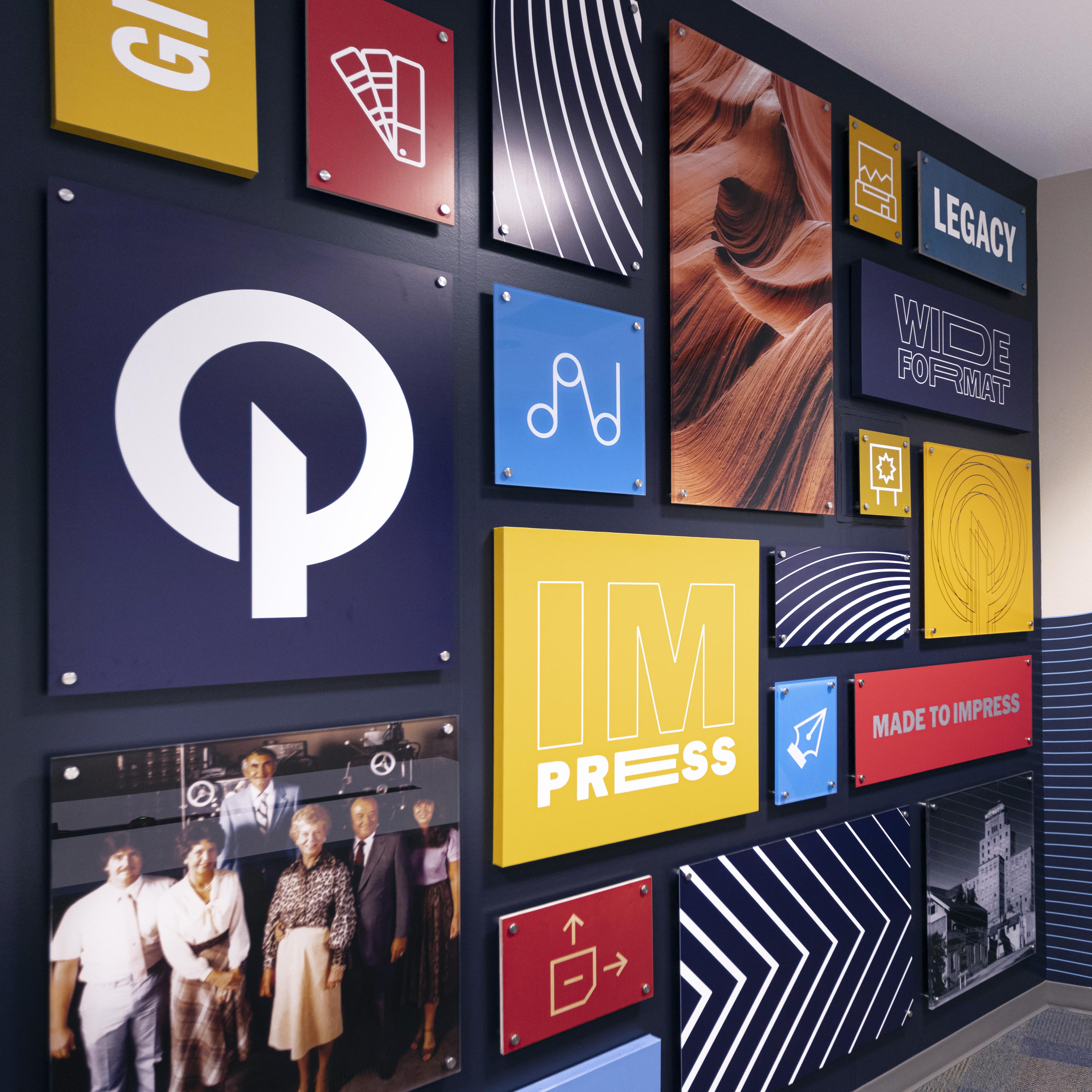 O'Neil Conference Room wall with a collaged grid of dimensional tiles showing text, icons, and photos