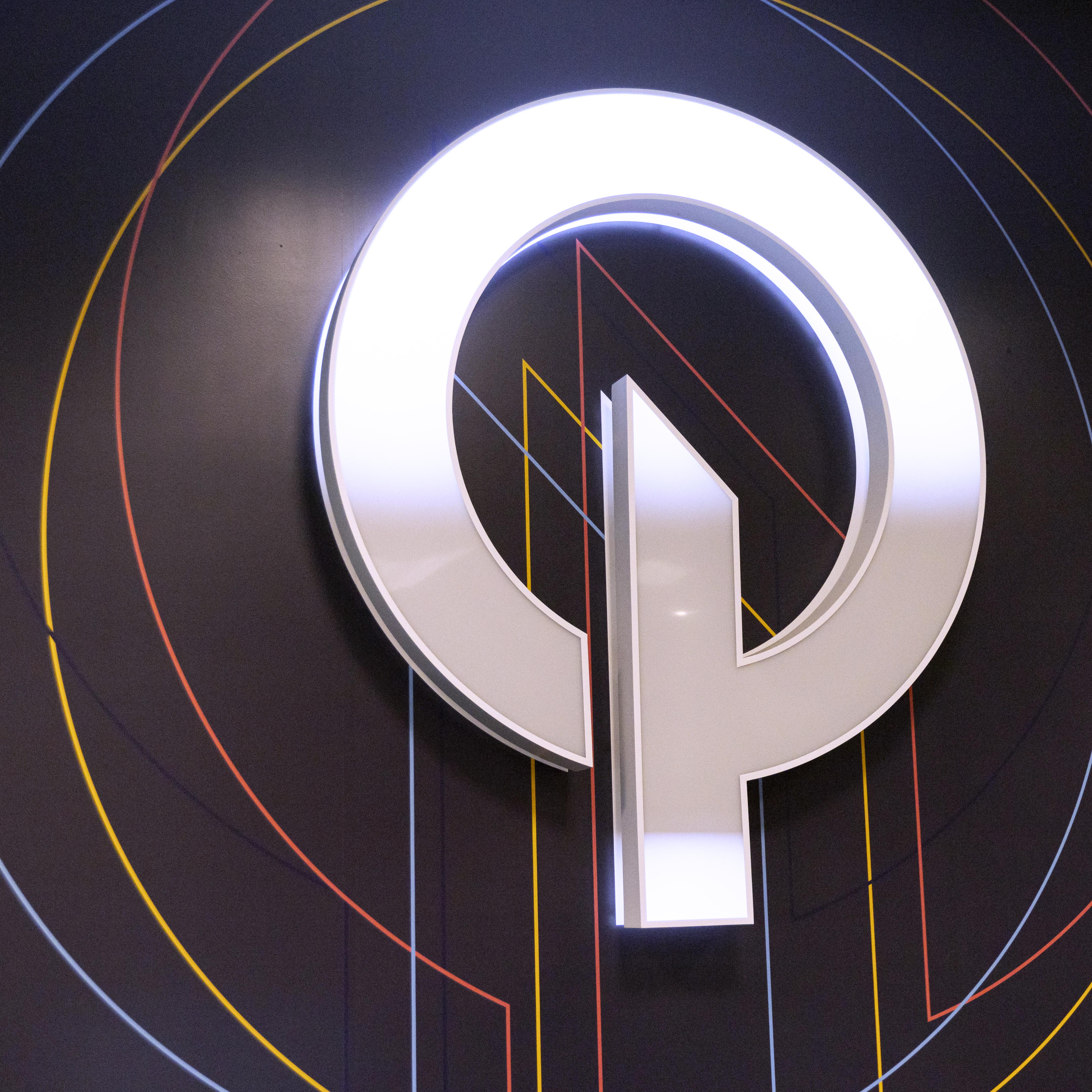 Backlit O'Neil logo on the lobby wall