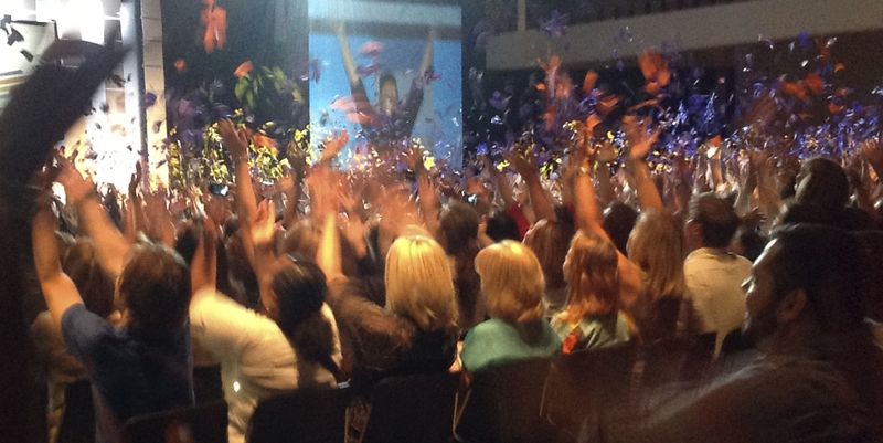 Crowd cheering at lively speech