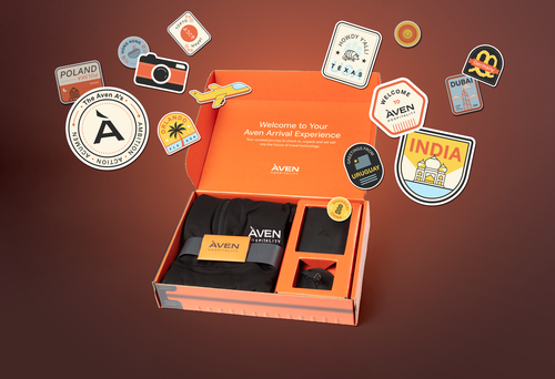 Opened Aven brand box with merch and sticker graphics