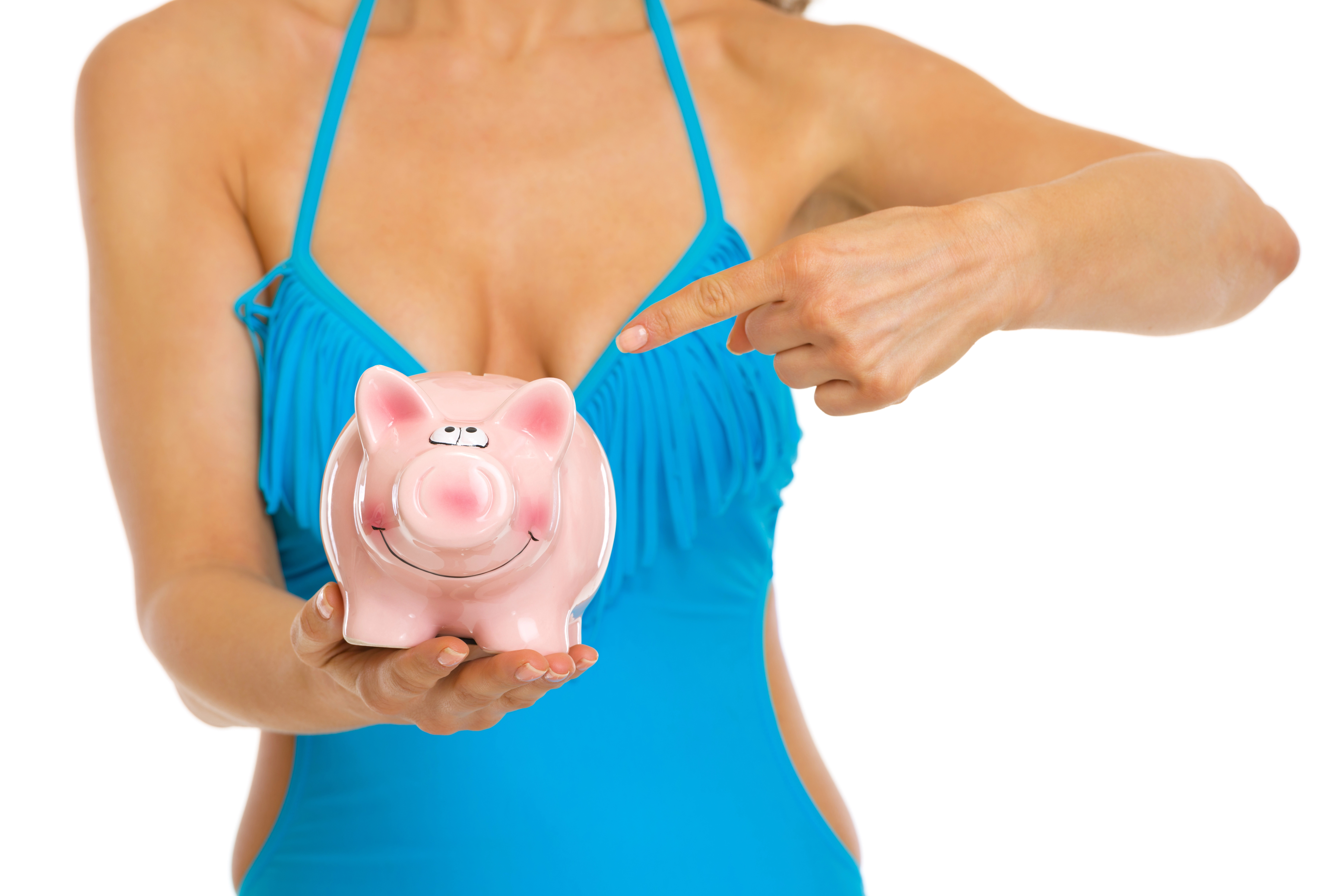Woman holding a piggy bank by breast