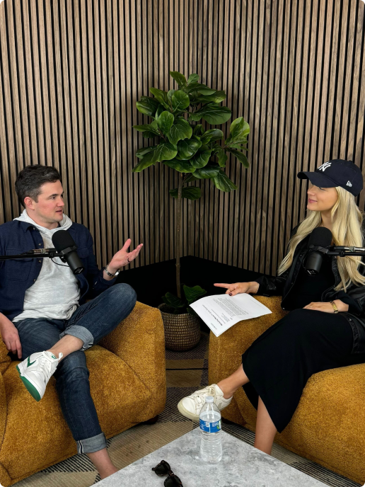 Two people talking during a podcast