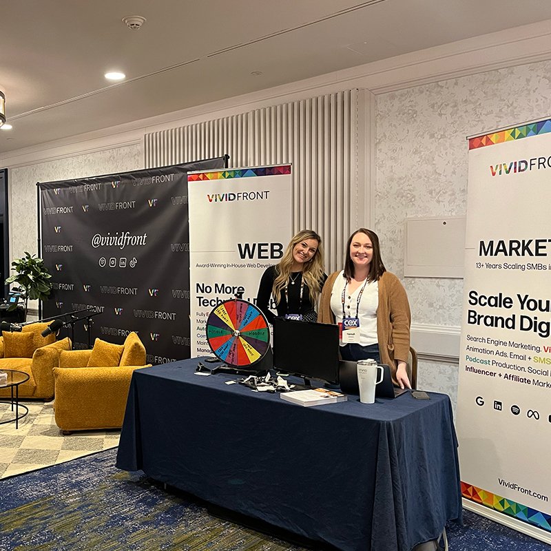 Vividfront team at the CEX event with the Marketing Moves podcast set up