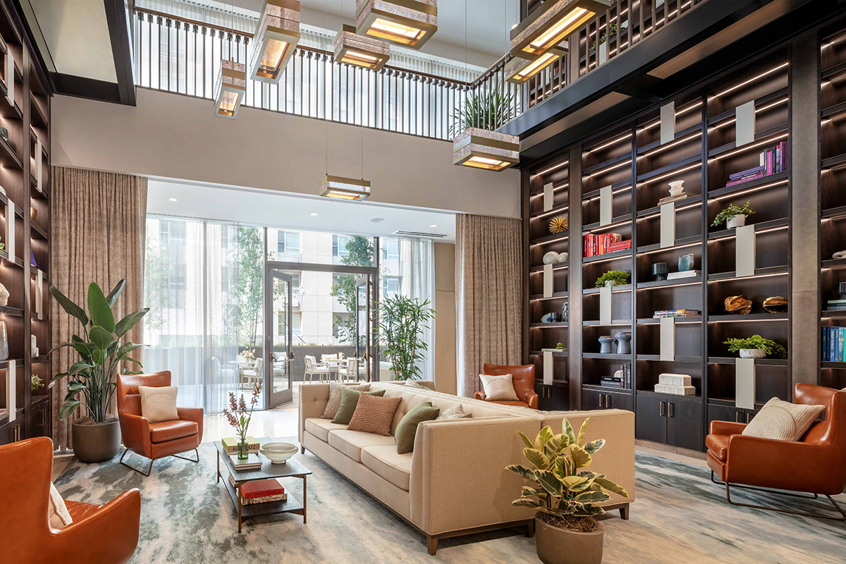 Luxury senior living lounge with library and warm furnishings