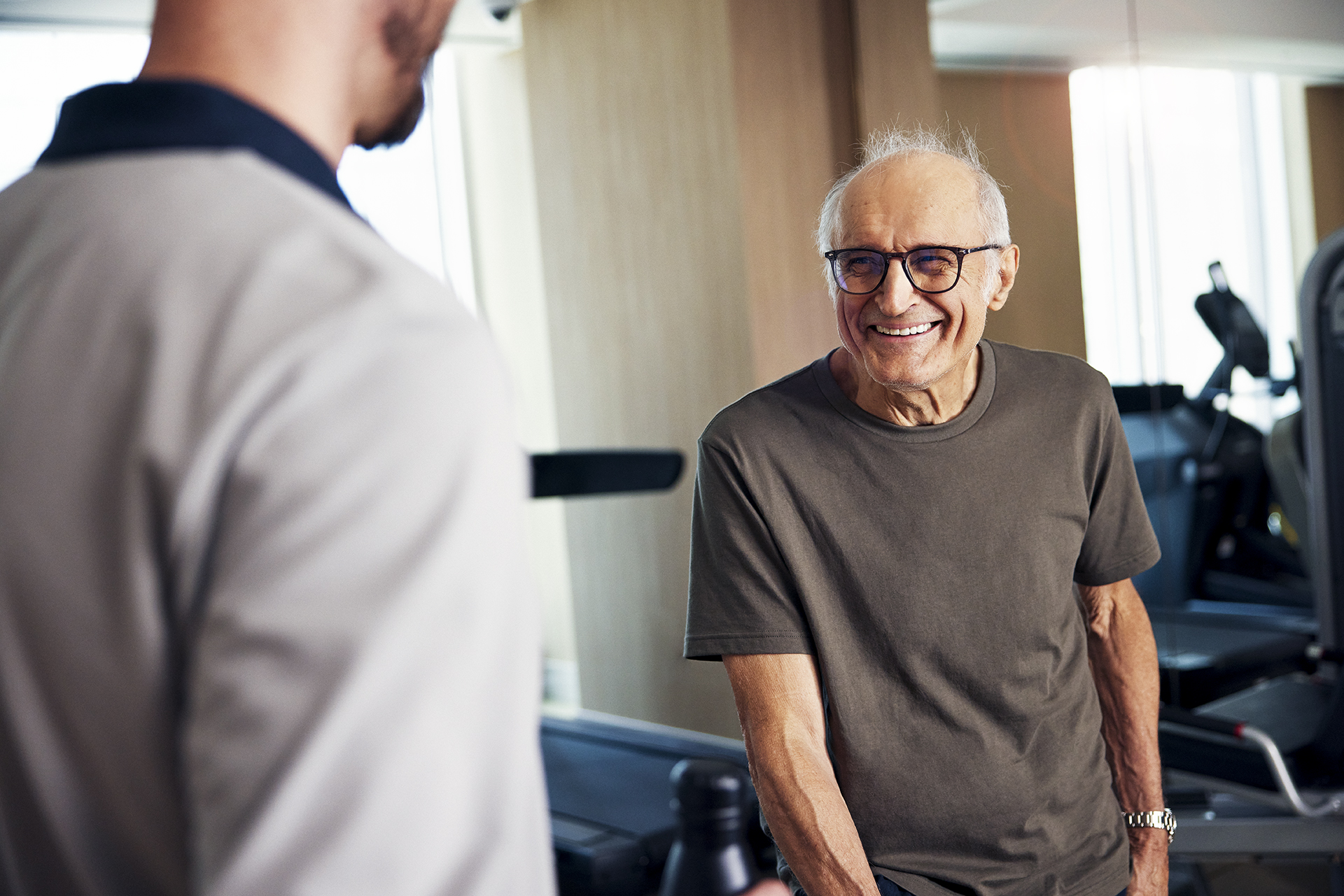Senior man smiling at caregiver