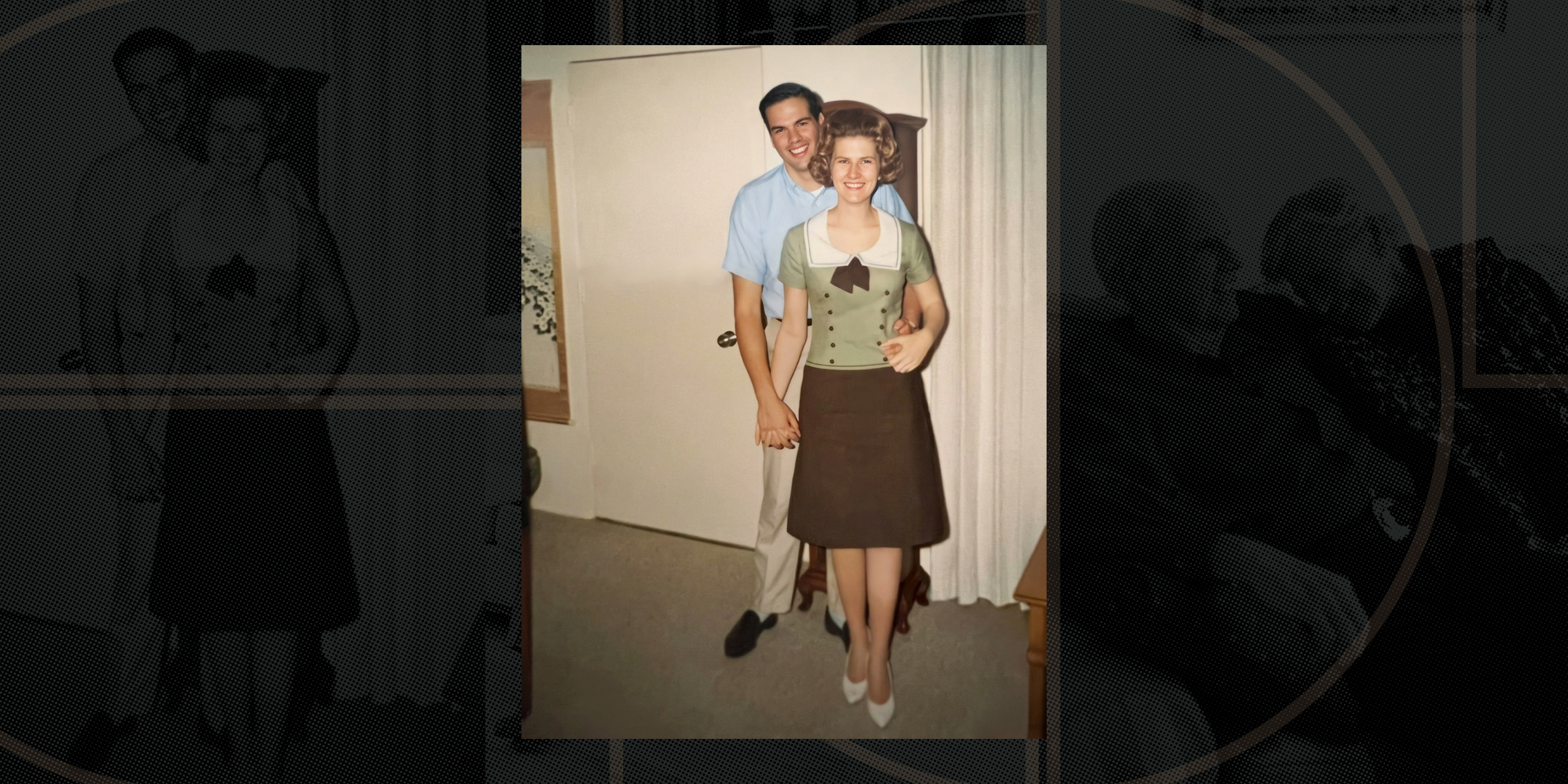 A smiling couple from the past stands indoors holding hands, with the man embracing the woman from behind.